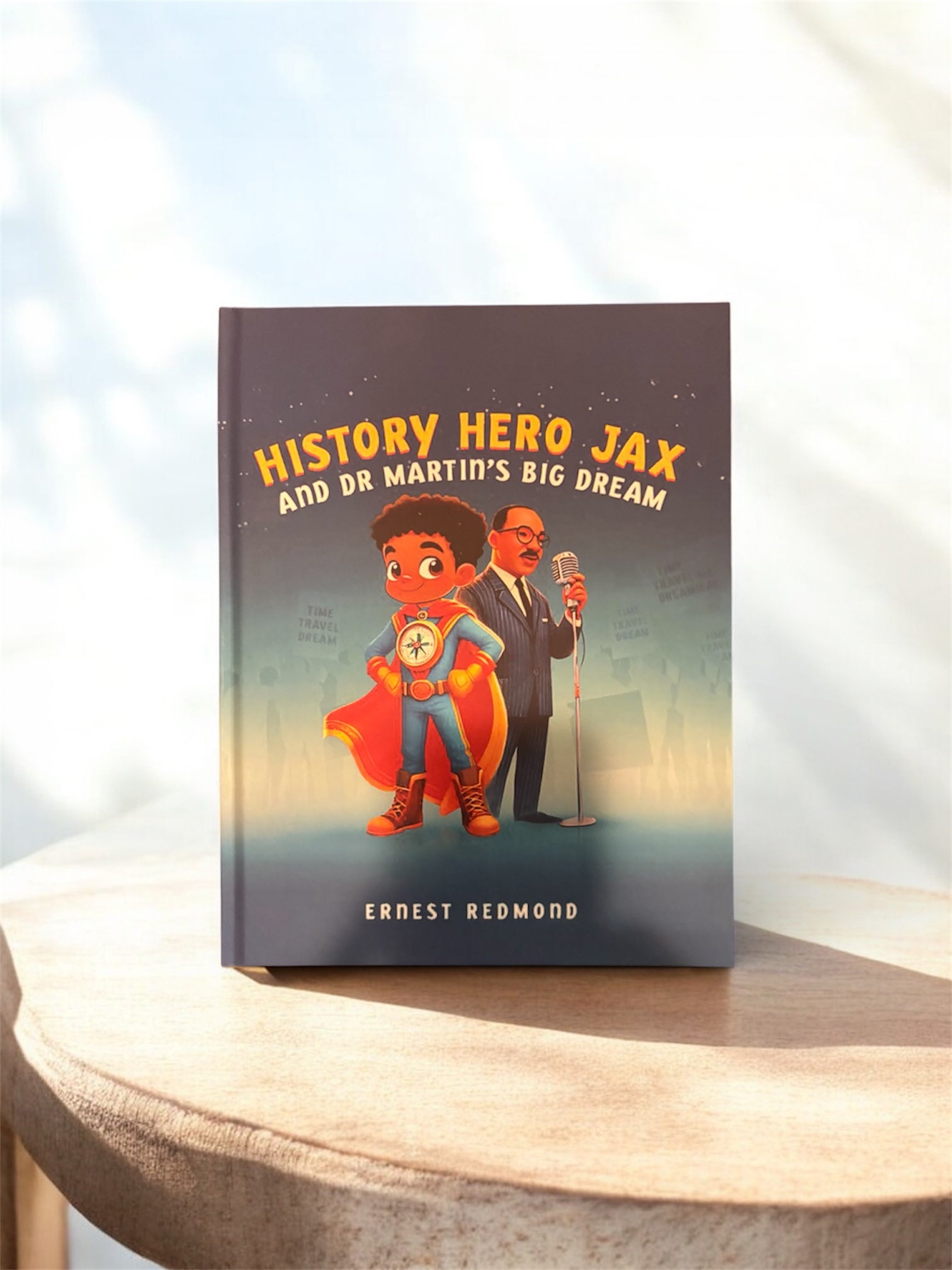 Book titled 'History Hero Jax and Dr. Martin's Big Dream' on a wooden surface